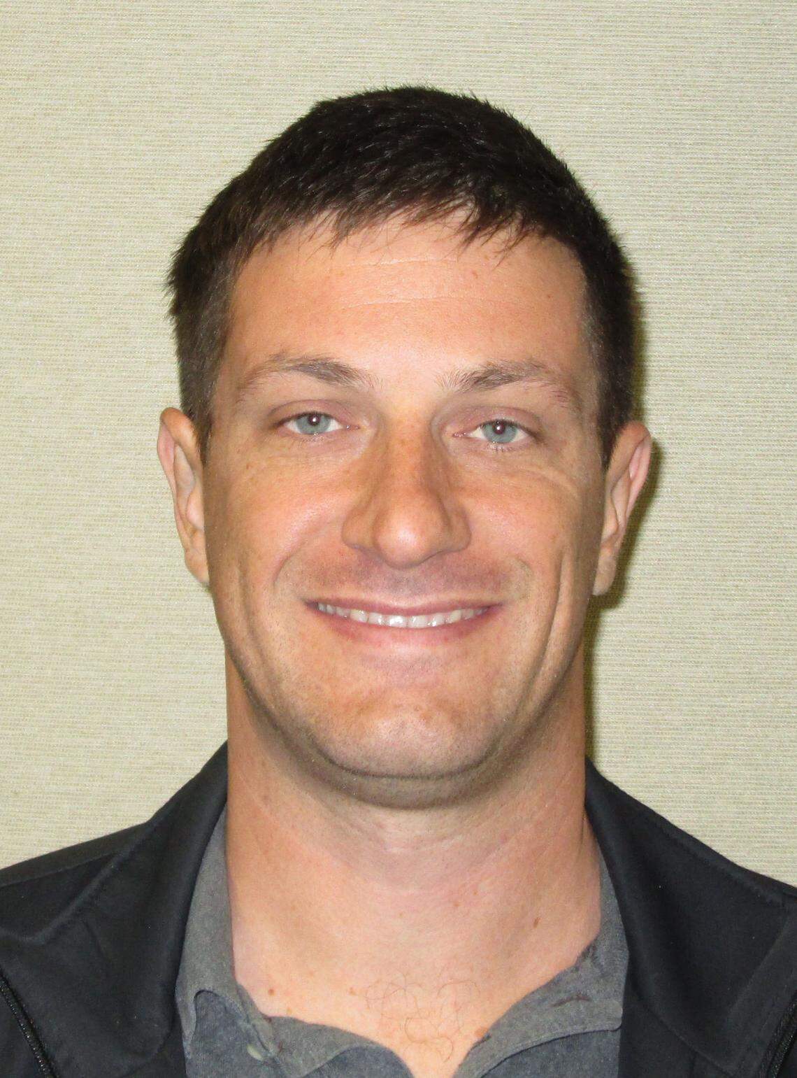 Chris Olcott lost his job as a San Luis Obispo building inspector after he was jailed for knocking out a women at a bar in Avila Beach.