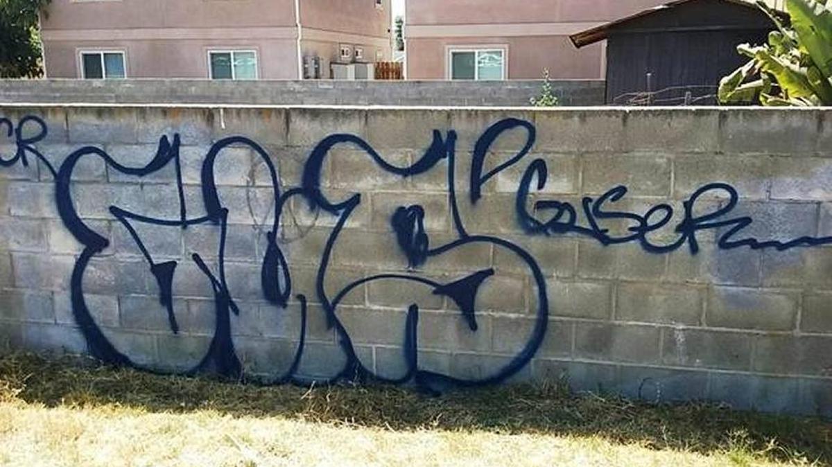 A graffiti-covered brick wall in Grover Beach. Police are searching for the tagger, who’s defaced buildings, fences and vehicles during the past two weeks.