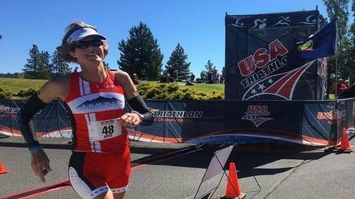 Bridget Dawson smiles during a race in the Vineman Triathlon. Dawson was killed July 14 when a car hit her during a bike ride on Highway 227.