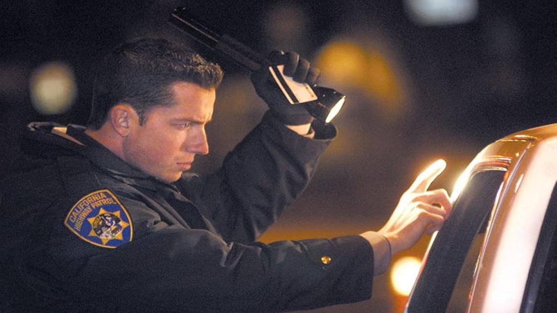 The San Luis Obispo Police Department plans to conduct DUI checkpoints and saturation patrols in the city on Saturday, August 12, 2017. Here, CHP Officer Dave Moyer observes a motorist at a DUI checkpoint on Marsh Street in 2006.
