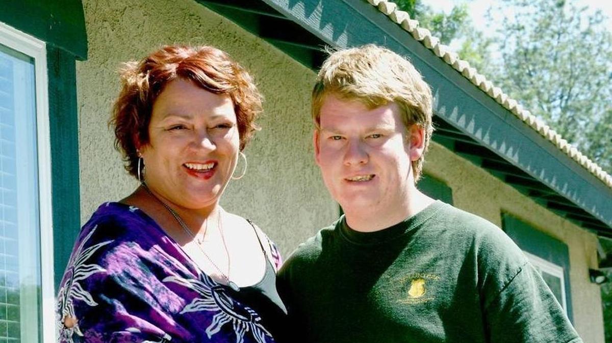 Tyler Jarvis and his mother, Michelle Christian, in front of the Tradewinds Home, a 24-hour residential care facility for people with Prader-Willi syndrome, in Riverside County on Monday.