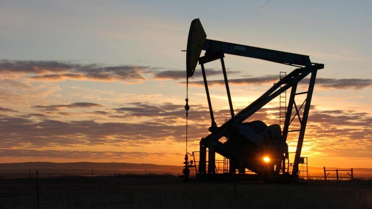In this Nov. 6, 2013, file photo, a Whiting Petroleum Co. pump jack pulls crude oil from the Bakken region of the Northern Plains near Bainville, Mont.