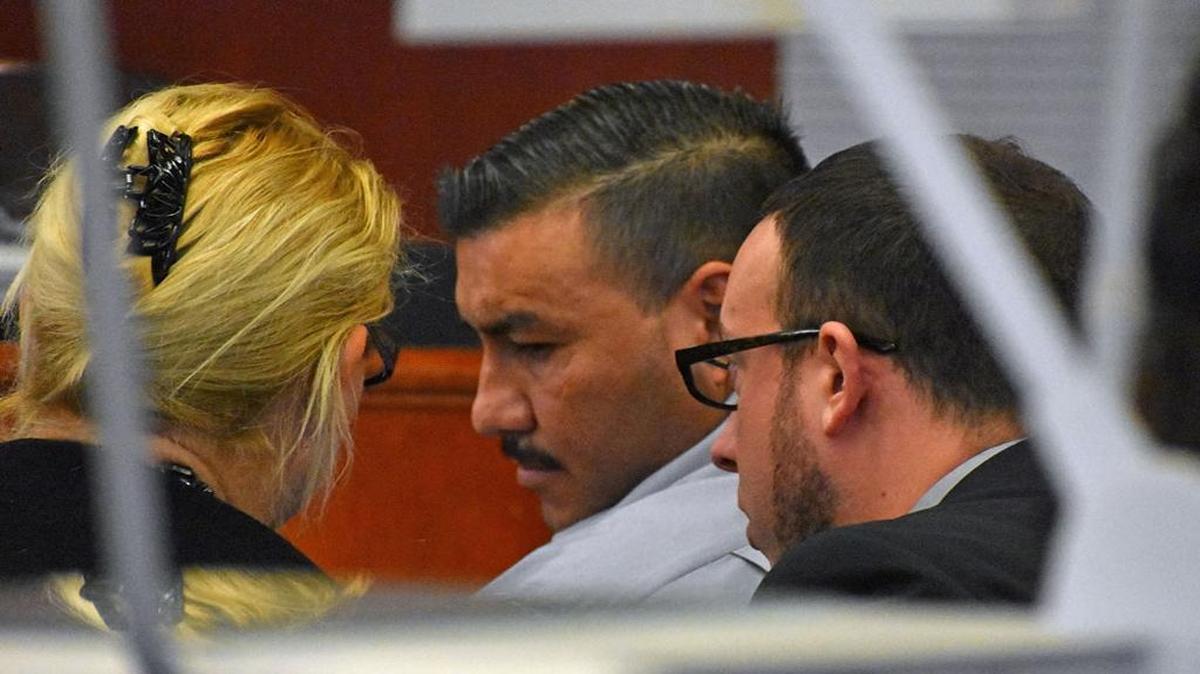 Victor Aureliano Martinez, 30, center, listens to his defense attorney Lori Pedego, left, and a Spanish translator Wednesday during his preliminary hearing on charges stemming from the violent attack and death of Marilyn Pharis, 64, in July 2015. He and a co-defendant, Jose Villagomez, 21, were ordered to stand trial.