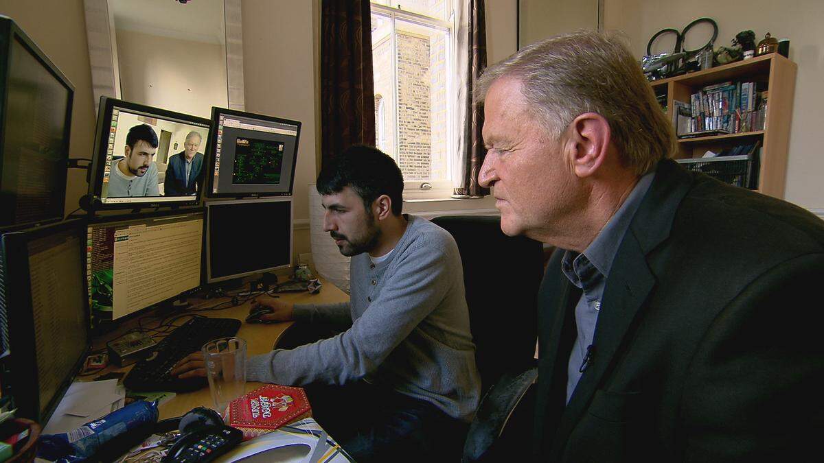 London cyber security expert Chris Monteiro, left, and CBS News correspondent Peter Van Sant appear in a scene from CBS News’ ”48 Hours: Click for a Killer.”
