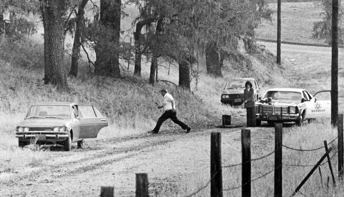 San Luis Obispo County Sheriff’s Office technicians measure the road in Atascadero on which the body of Jane Antunez was found on Nov. 18, 1977. Antunez’s body was found in the back seat of her car. On Wednesday, April 17, 2019, the San Luis Obispo County Sheriff’s Office announced it had identified a suspect, Arthur Rudy Martinez, in the 41-year-old cold case.