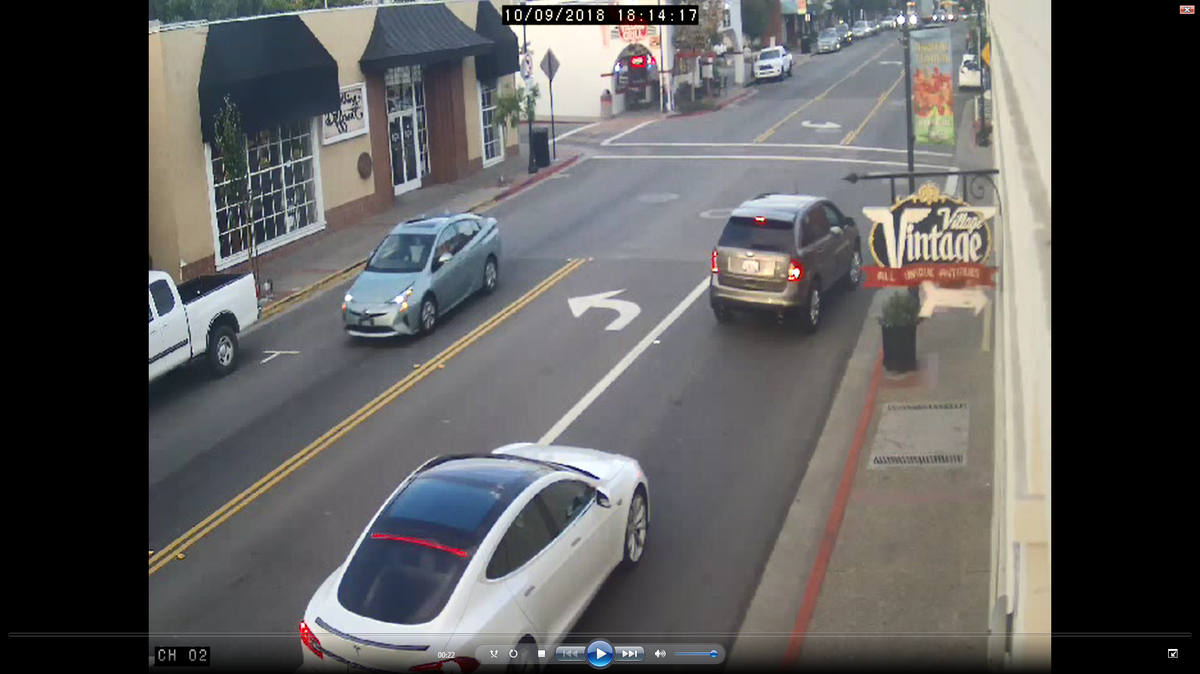 A seafoam Toyota Prius with a sunroof (left) vandalized 11 signs for Arroyo Grande Mayor Jim Hill’s re-election campaign, police said when they released this surveillance footage still in October..