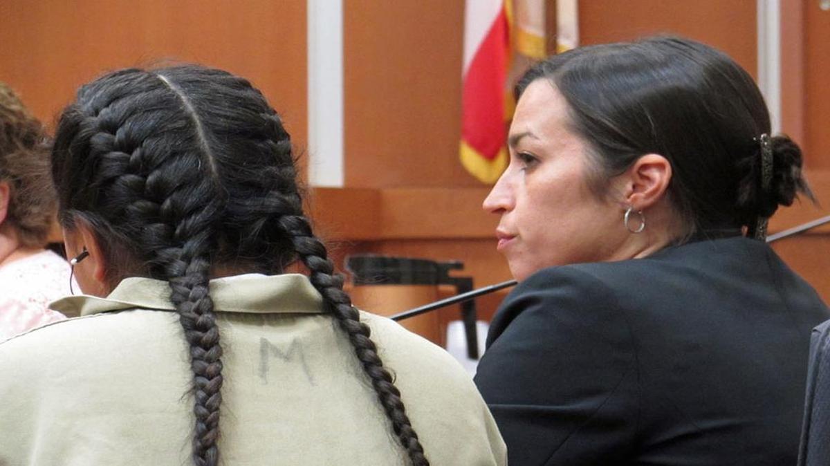 Maribel S., then 15, sits in a Santa Maria Juvenile Court alongside Deputy Public Defender Lea Villegas, right, before a judge ruled the girl guilty of second-degree murder in the death of her newborn baby.