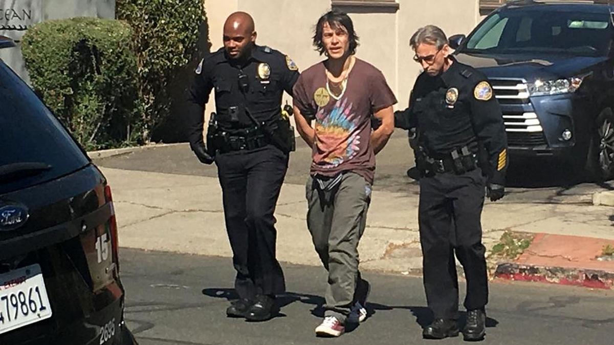 Officers arrested a man Wednesday in downtown Santa Barbara after he allegedly confronted a motorist driving a Tesla automobile.