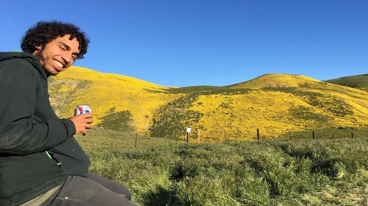 Kennedy Love, 22, who was killed in a suspected drunken-driving hit-and-run in San Luis Obispo on Tuesday night, smiles during a visit to see the superbloom on the Carrizo Plain this past spring.