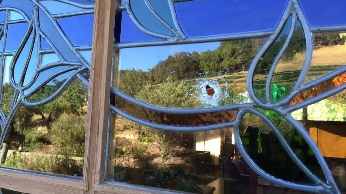 A bullet hole found at the scene of an alleged armed robbery during a house party in rural Templeton in July.