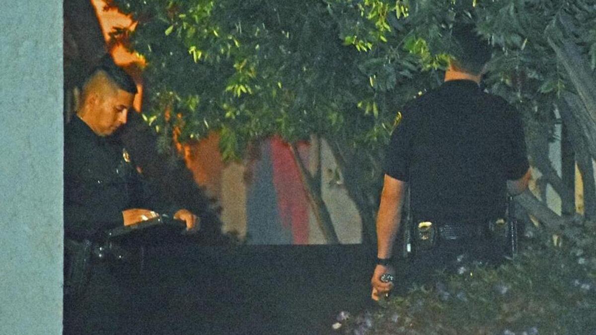 Santa Maria police officers investigate Monday night after a woman was killed, apparently shot to death, on the 200 block of College Drive