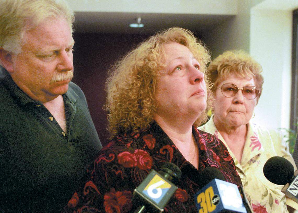 Gail Crawford, the mother of Aundria Crawford, pauses for a moment to compose herself while addressing the media after the formal sentencing of Rex Allan Krebs. She is flanked by Aundria’s Uncle Terry and grandmother Jody in 2001.