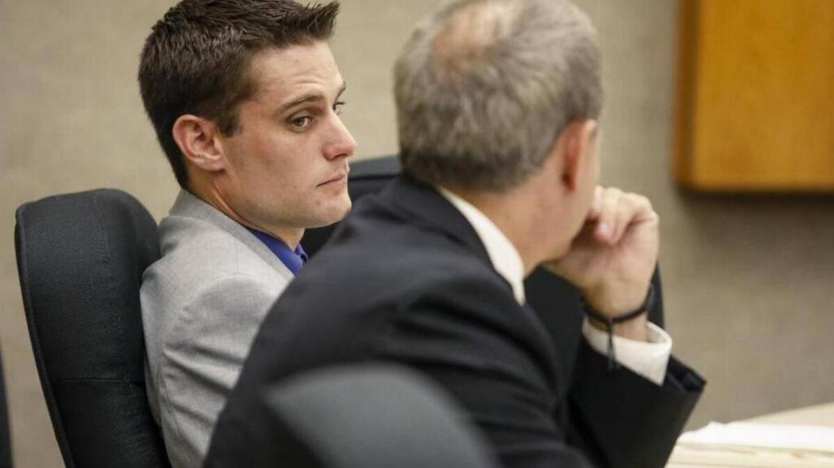 Former Grover Beach police officer Alex Geiger, left, appears with his attorney John Jackson Monday at the beginning of his preliminary hearing on felony charges of involuntary manslaughter and failing to maintain control of a dangerous animal. A judge ruled Wednesday that Geiger will face trial on all three counts.