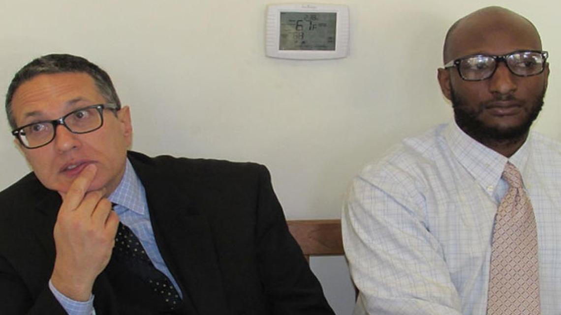 Ramoan Blackmon, right, was sentenced to five years of felony probation for child molestation and released from jail on Monday. Sitting with the former youth basketball coach outside court is his attorney Addison Steele.