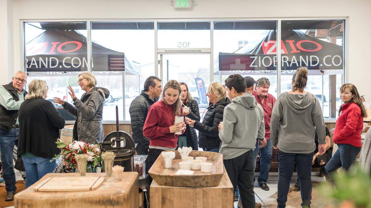 Patrons at the Zio Brand Meats and Sausage grand opening in Paso Robles, CA on Dec. 10, 2022.