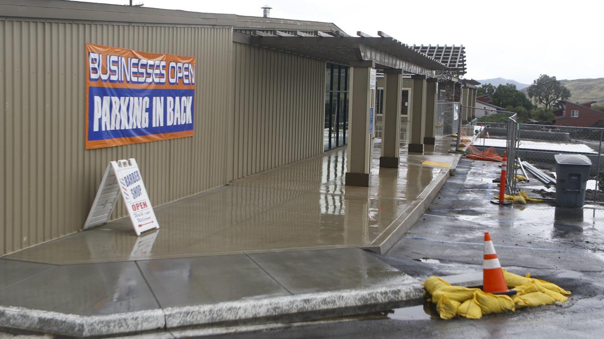 San Luis Obispo's Laurel Lane shopping center is still under construction with upgrades ongoing through the summer. The center's developer, Patrick Aurignac, is improving the site, which will include an Efren's restaurant. A coffee shop, barber shop and liquor store are open while improvements are made.