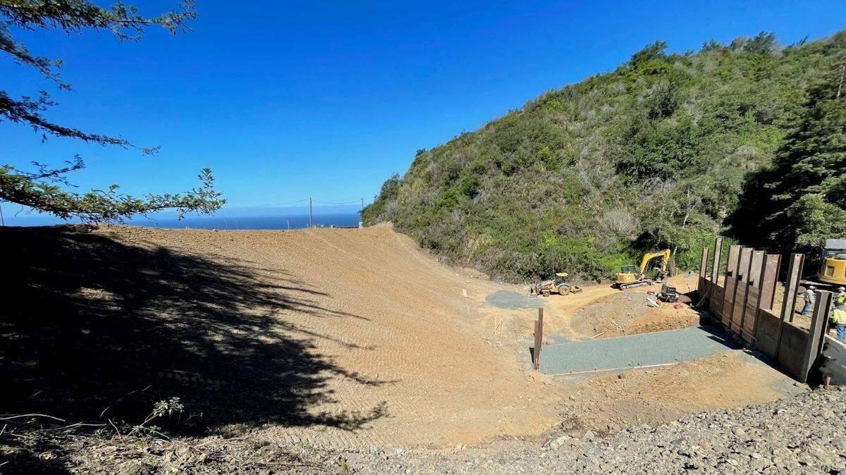 The eastern side of Highway 1 at Dani Creek has been reconstructed. Next, tunneling operations will drive a culvert through the fill below the roadway.