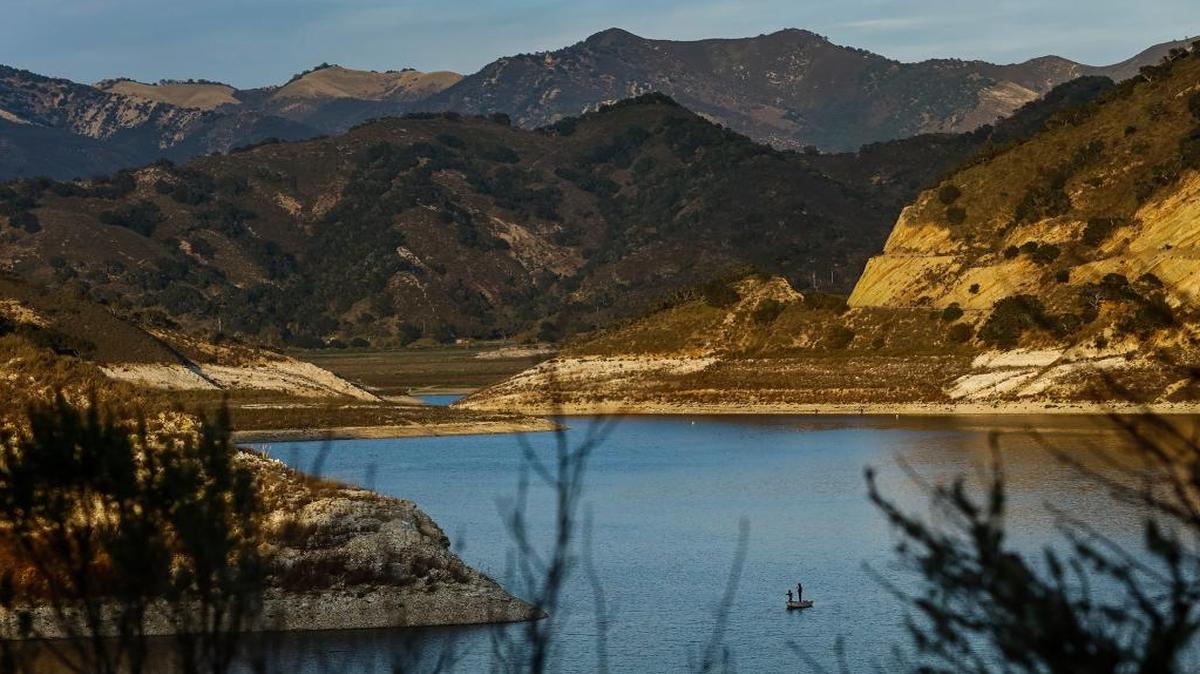 A pair of fishermen cast their lines into the waters of Lopez Lake.
