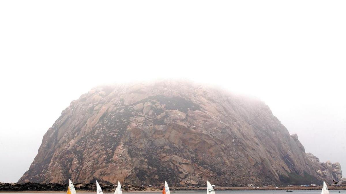 Sailboats sail in the harbor around Morro Rock in Morro Bay on a cool, foggy Sunday afternoon. Central Coast State Parks Association is hosting a talk Monday, Feb. 6, 2017, on how World War II impacted the creation of Morro Bay harbor.