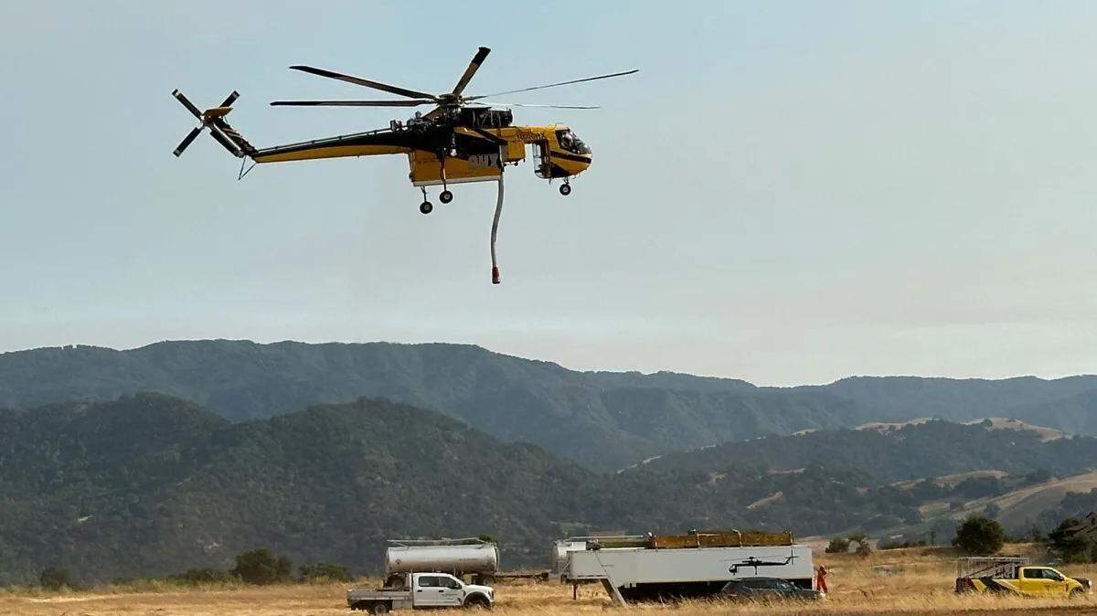 A Sikorsky Skycrane helicopter lifts off from the Santa Ynez Airport after refueling. A large fleet of aircraft has been helping to battle the Lake Fire north of the Santa Ynez Valley.