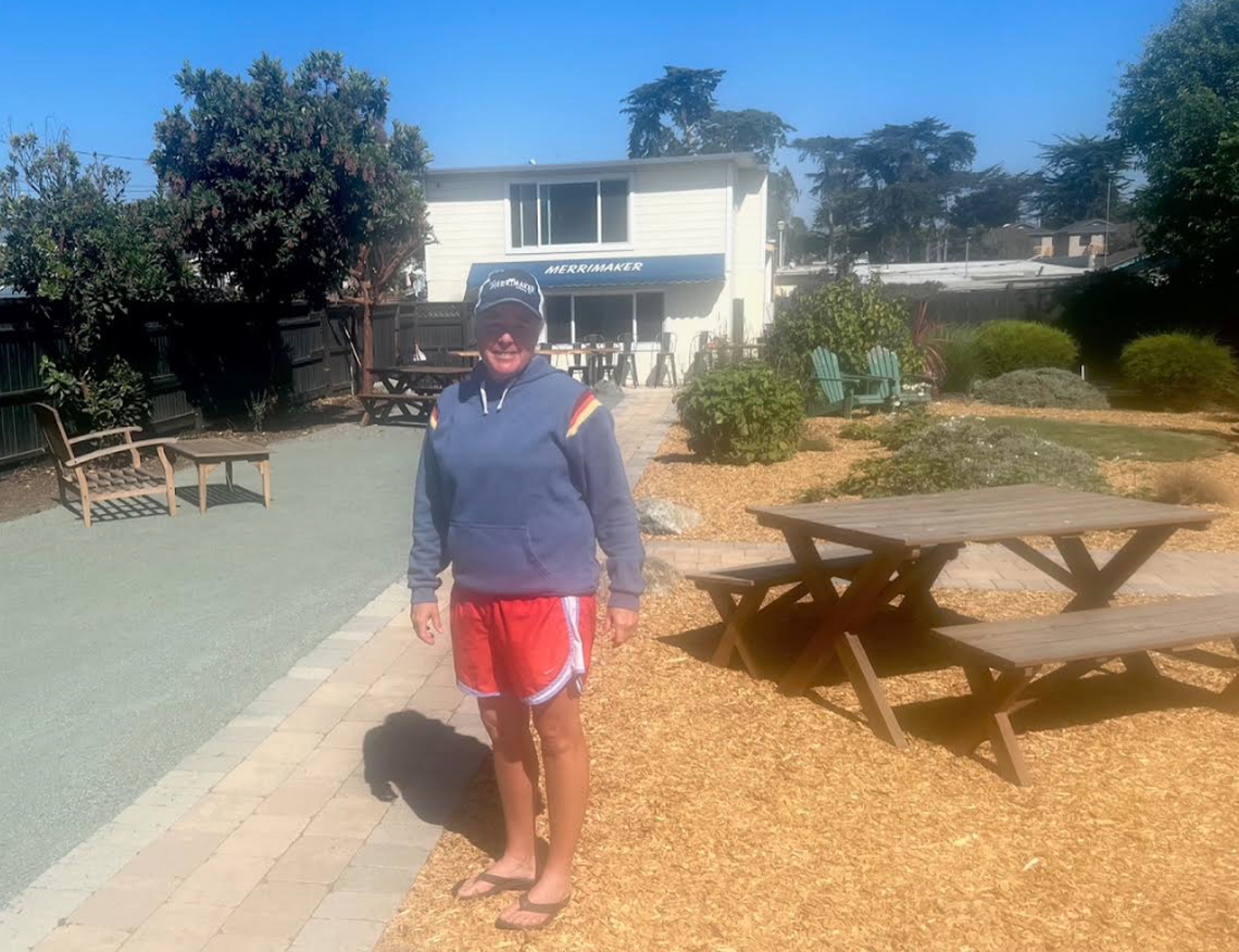 Jennifer Dorn, new owner of Niffy’s Merrimaker in Los Osos, stands in the bar’s beer garden. 