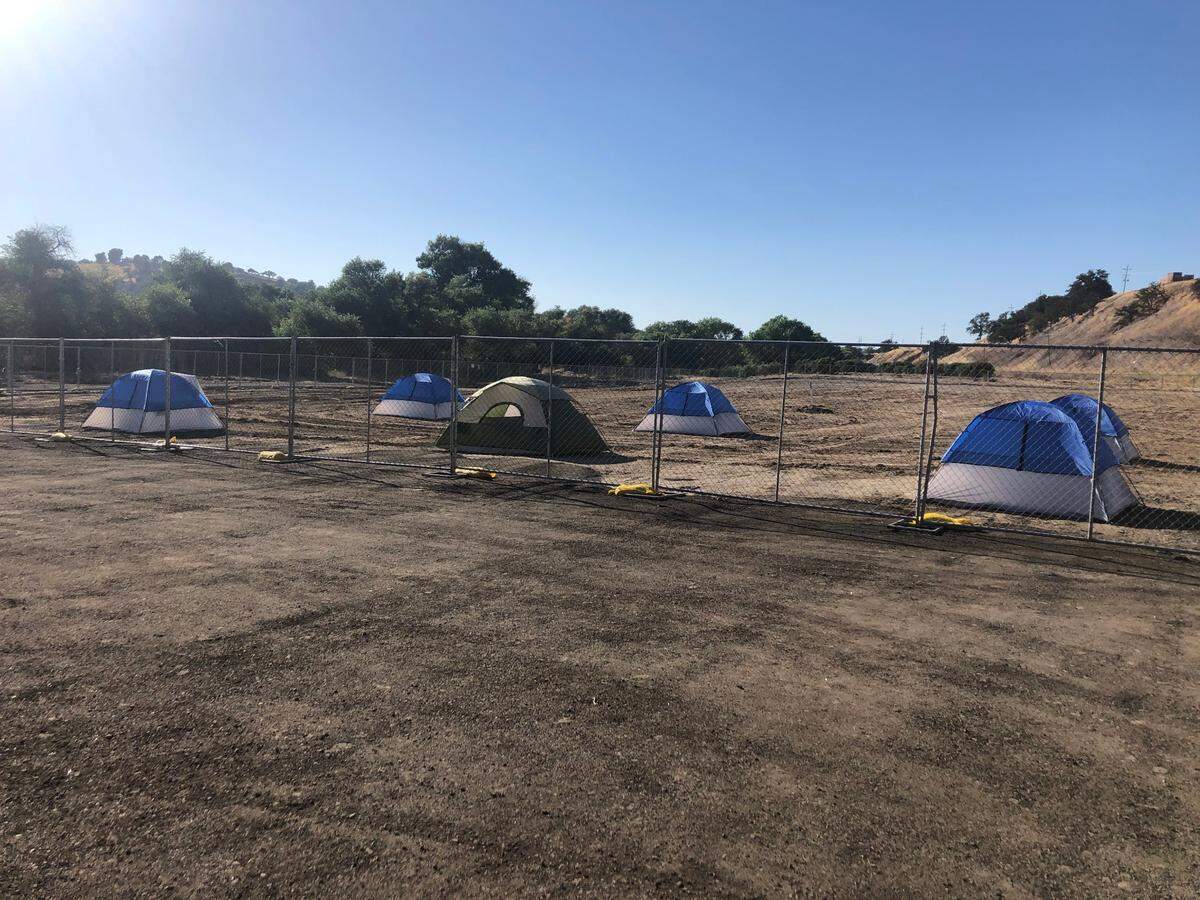 Paso Robles has set up tents at a temporary homeless camp the city recently built at the Borkey Flats site off River Road north of the 24th Street Bridge. The city will soon close the site ahead of rainy, cold winter months.