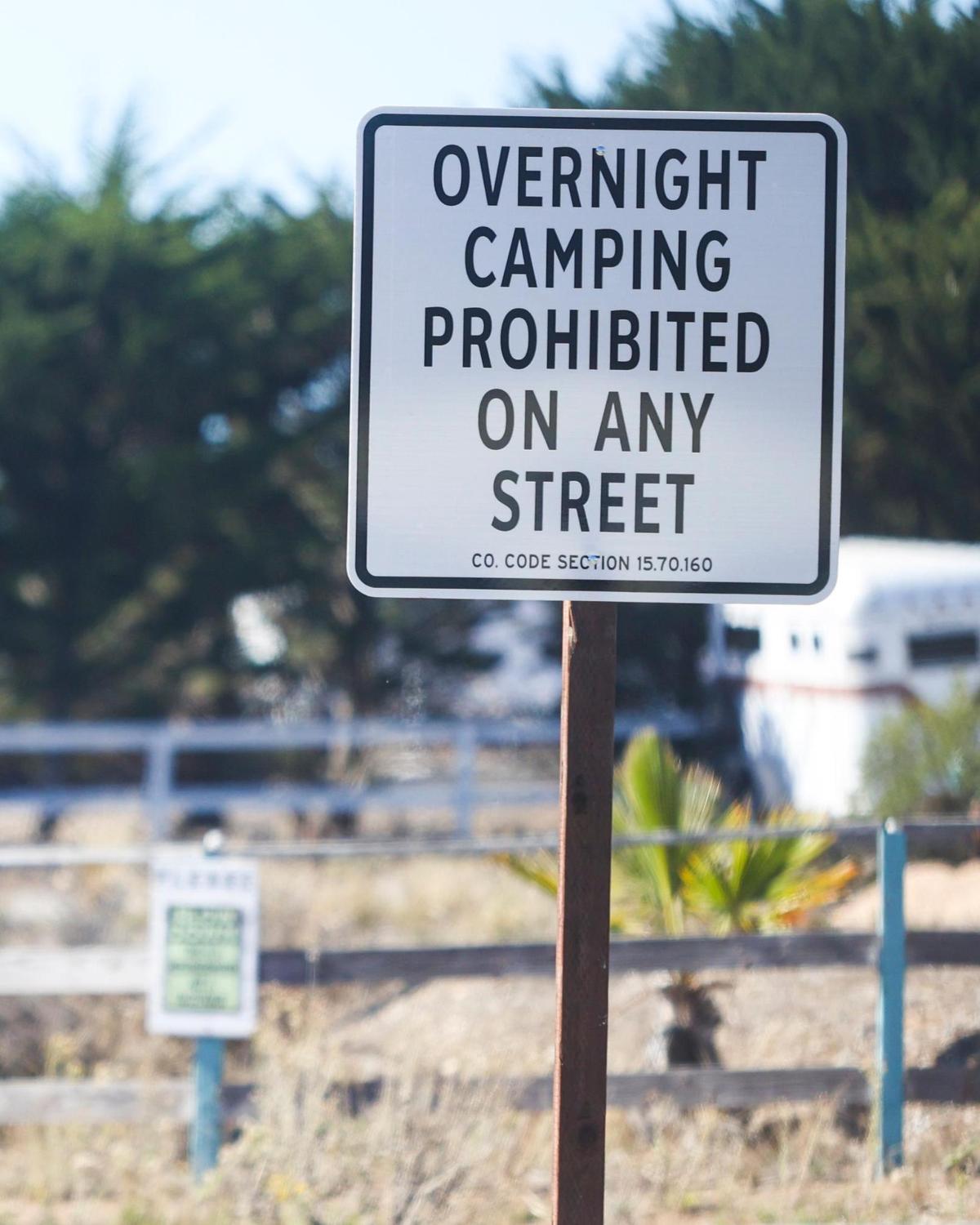 San Luis Obispo County recently installed signs in Los Osos advertising a new no overnight camping policy that recently went into effect. The signs — like this one at the corner of Nipomo Avenue and Mountain View Drive — are meant to prevent unhoused residents from sleeping in their vehicles and living on streets in the community.