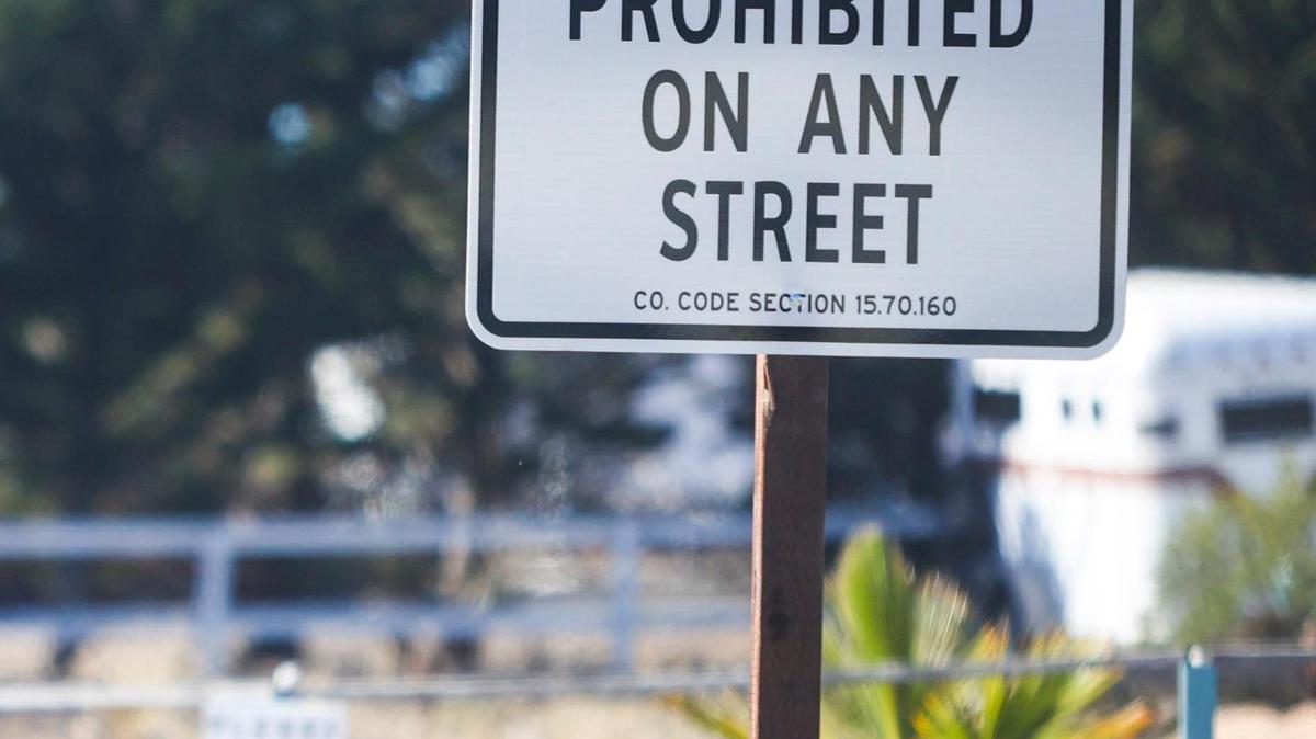 San Luis Obispo County installed signs in Los Osos advertising a no overnight camping policy. They are meant to prevent unhoused residents from sleeping in their vehicles and living on streets in the community.