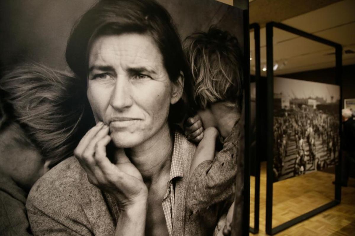 Dorothea Lange’s 1936 photo “Migrant Mother” was taken less than a mile from where Greg France’s urban farm home for workers would be burned to the ground 80 years later. (The image is shown here on display at the Oakland Museum of California.)