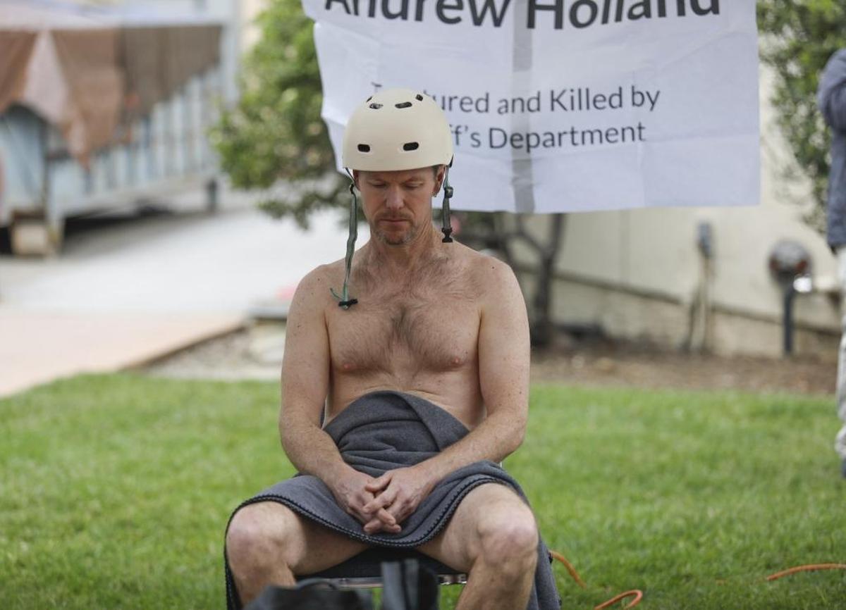 Several San Luis Obispo County advocacy groups participated in a protest Saturday to demand justice following a video released by The Tribune on Friday that showed inmate Andrew Holland's death at County Jail last year. For 46 hours from 1 p.m. Saturday to 11 a.m. Monday, activists took turns sitting in a makeshift restraint chair. Tim Jouet of San Luis Obispo was the first person to sit in the chair.