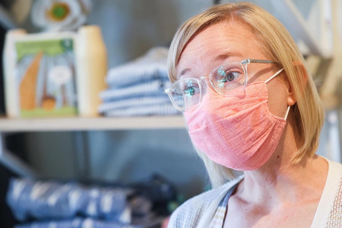LynAnne Wiest, manager at HumanKind Fair Trade in San Luis Obispo, says that vaccinated customers don’t have to mask but staff will continue to wear them.