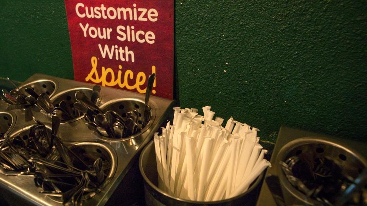 Restaurants like Woodstock’s Pizza will still be able to provide plastic straws in self-service bins, where it’s the consumer’s choice whether to take one.