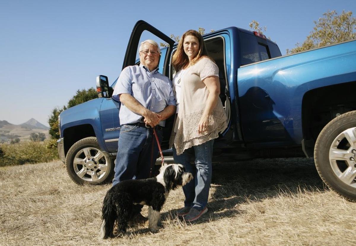Peter and Mary Beth Oppenheimer with their dog, Ollie. The longtime Cal Poly supporters are funding the Oppenheimer Family Equine Center on the northern end of Cal Poly’s campus.