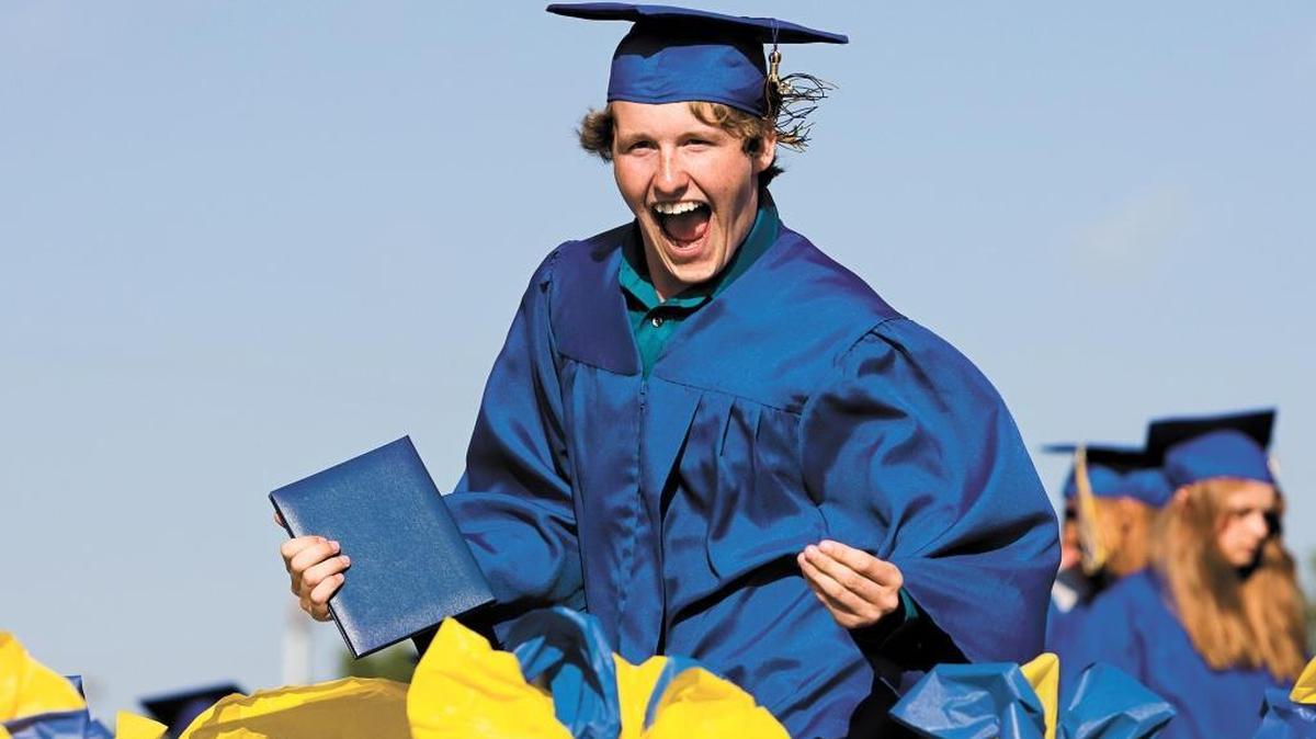 Damion Biddy celebrates during the presentation of diplomas at Arroyo Grande High School’s 2013 graduation ceremony.