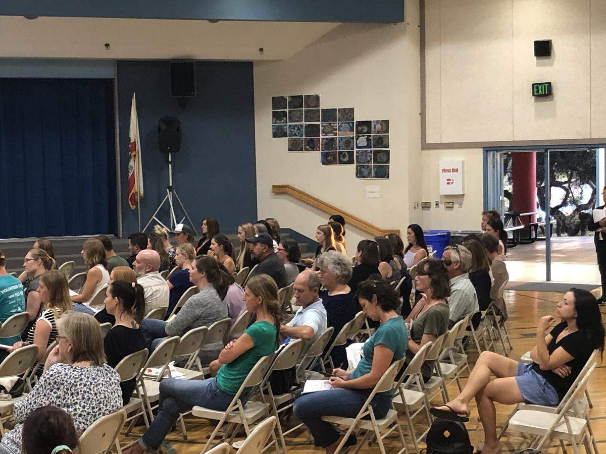 Parents listen to a presentation about bilingual education at a meeting Thursday. The school district board will decided whether to add bilingual education at Baywood Elementary in Los Osos on Tuesday.