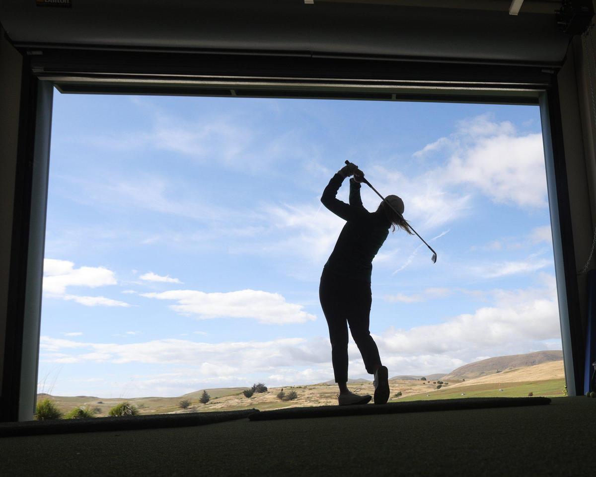 Cal Poly golfer Caroline Cantlay hits a ball at Cal Poly’s practice facility at Dairy Creek on April 21, 2022.