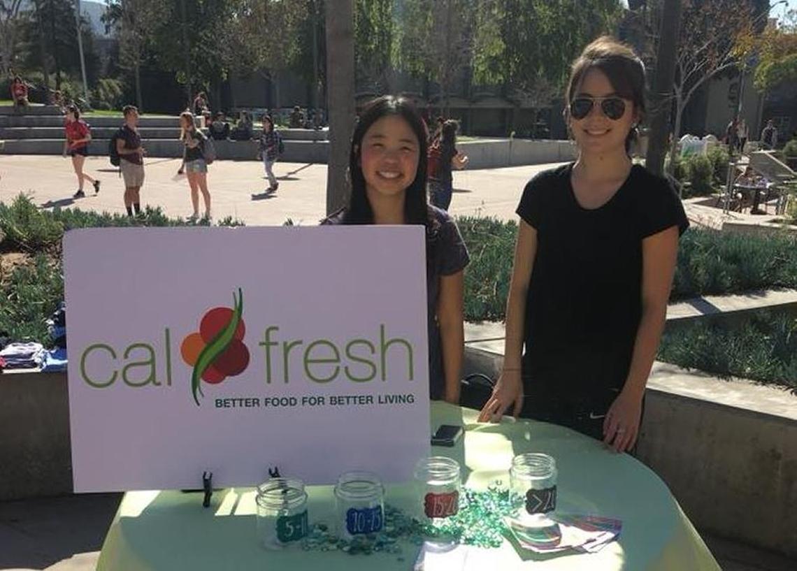 CalFresh outreach staff members set up a table to answer student questions at Cal Poly’s University Union Plaza.