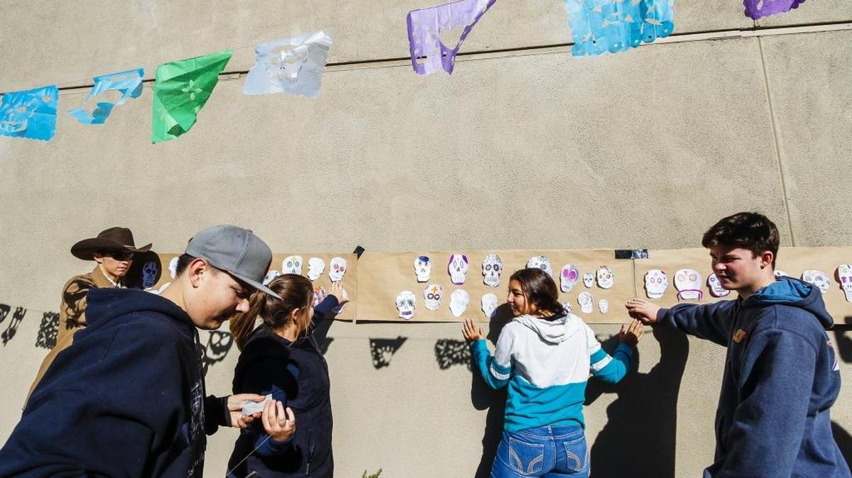 Students from Camille Hayes’ Spanish class put up a display of Calavera skulls as they and about 170 students from Templeton High School’s Spanish classes put together an “ofrenda” presentation to honor the deceased as part of the Spanish holiday Dia de los Muertos.