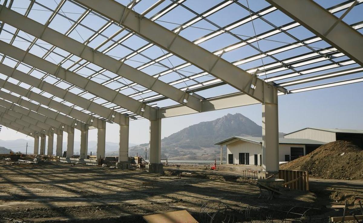 The covered riding pavilion for the Oppenheimer Family Equine Center at Cal Poly is expected to be complete in February 2018. Bishop Peak can be seen in the background.