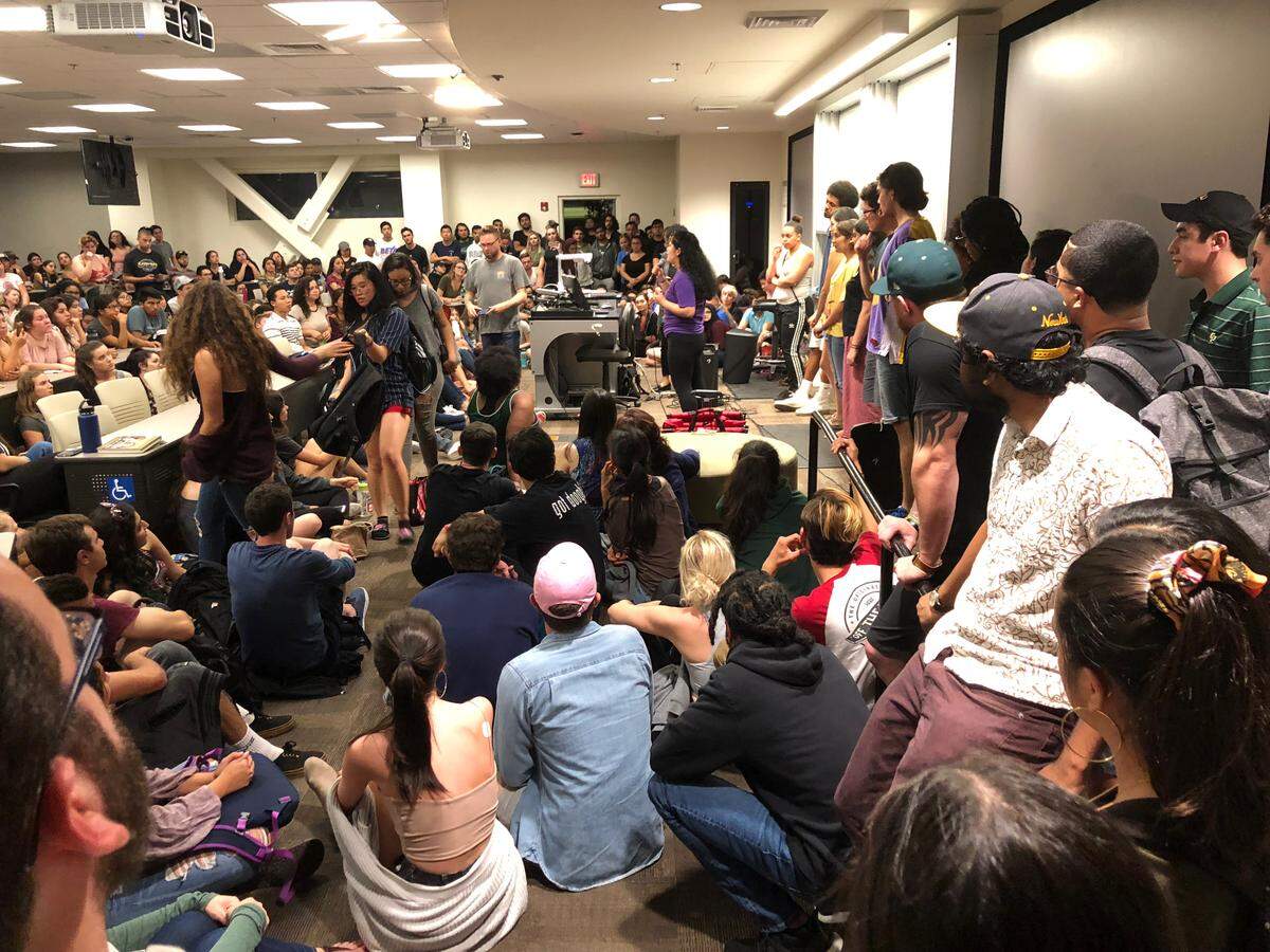 Hundreds of Cal Poly students packed into a classroom Monday, April 9, 2018, as part of an emergency town hall to protest racially insensitive pictures of Lambda Chi Alpha fraternity members that emerged online.