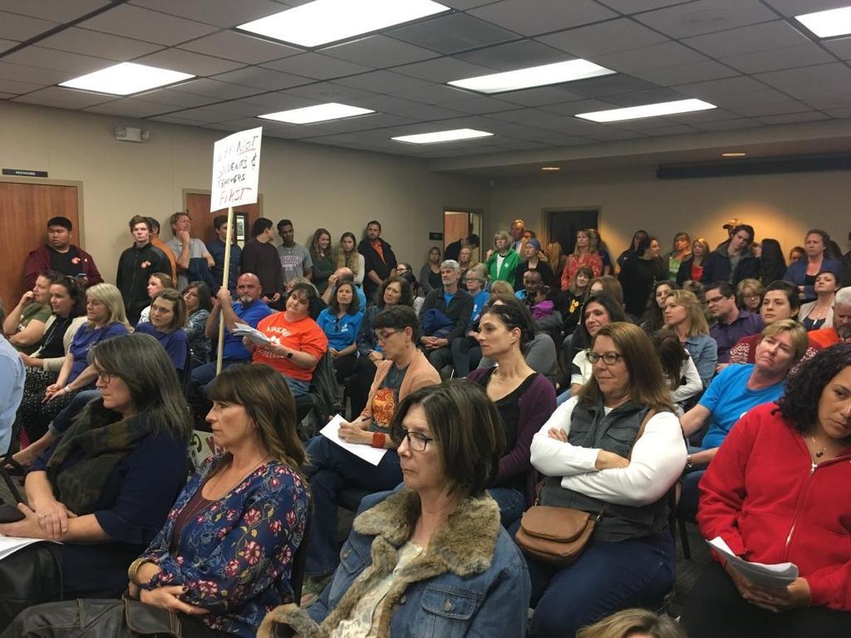 Atascadero Unified School District teachers and parents listen to speakers during a Board of Trustees meeting on Tuesday, February 6, 2018. The group packed the meeting to protest a management bonus and express their frustration over large class sizes and a lack of funding for classroom supplies.