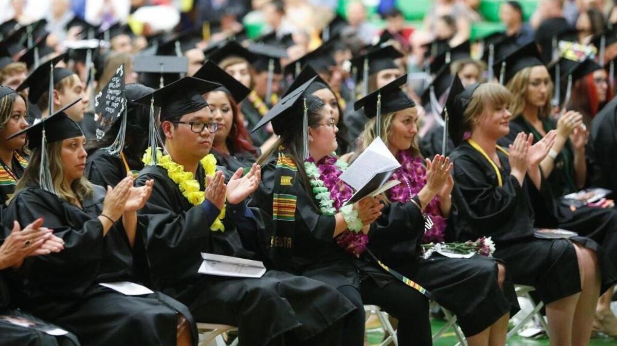 Cuesta College graduates applaud during commencement ceremonies in May 2017.