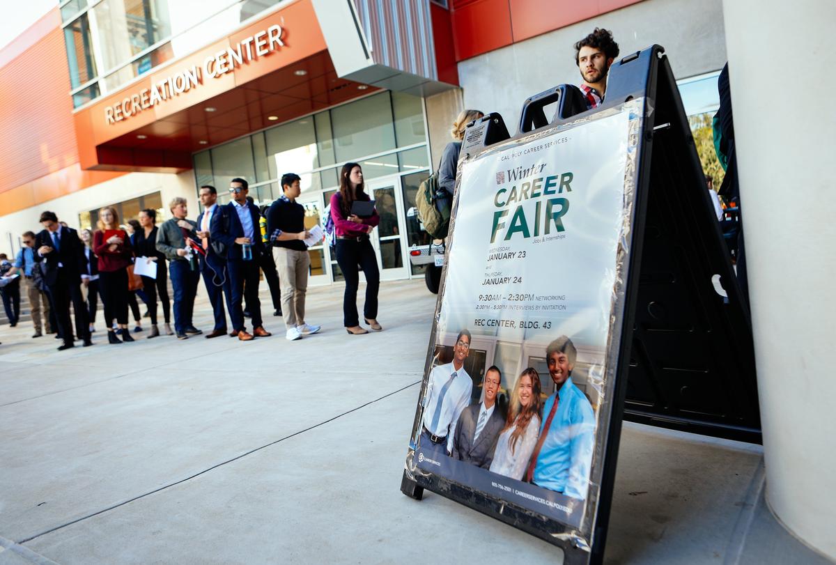 Students line up to enter the Cal Poly Career Fair as more than 30 Cal Poly students protested the university’s ties to weapons contractors such as Raytheon, Boeing and Northrup Grumman, urging the university to “divest from war” and put “peace over profits.”