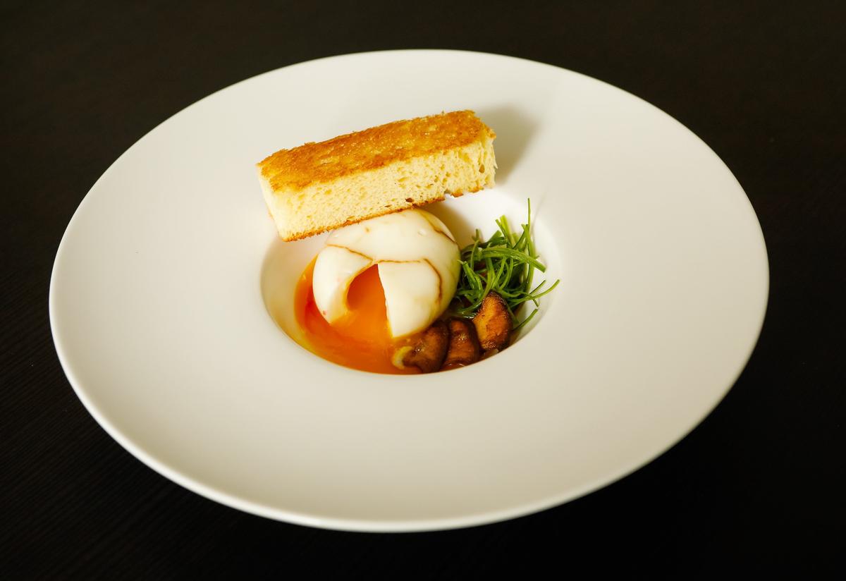 Cal Poly student Jimmy Wong’s 62-degree tea egg features a hard-boiled egg steeped in tea and soy broth, drizzled with Chinese red vinegar and served with sliced scallions, sauteed trumpet mushrooms and toasted brioche. Wong runs a pop-up restaurant, Dench, out of his studio apartment in San Luis Obispo.