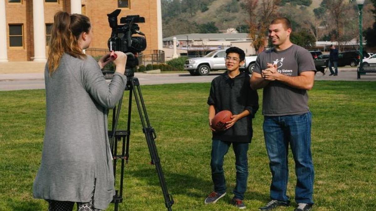 Jacob Gersh, who was awarded for his exemplary service with Big Brothers Big Sisters of San Luis Obispo County, and his 13-year-old “Little Brother,” Arual, are interviewed for a local news story.