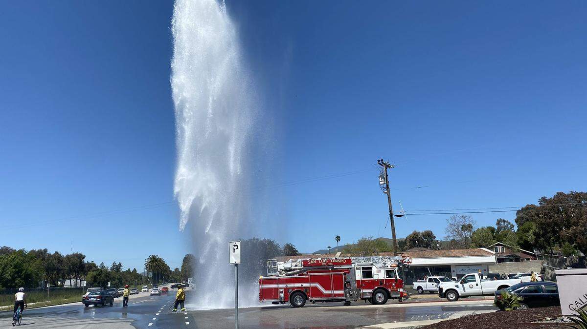 A fire hydrant burst after being struck by a semi-truck on California Boulevard on Thursday, April 11, 2024.