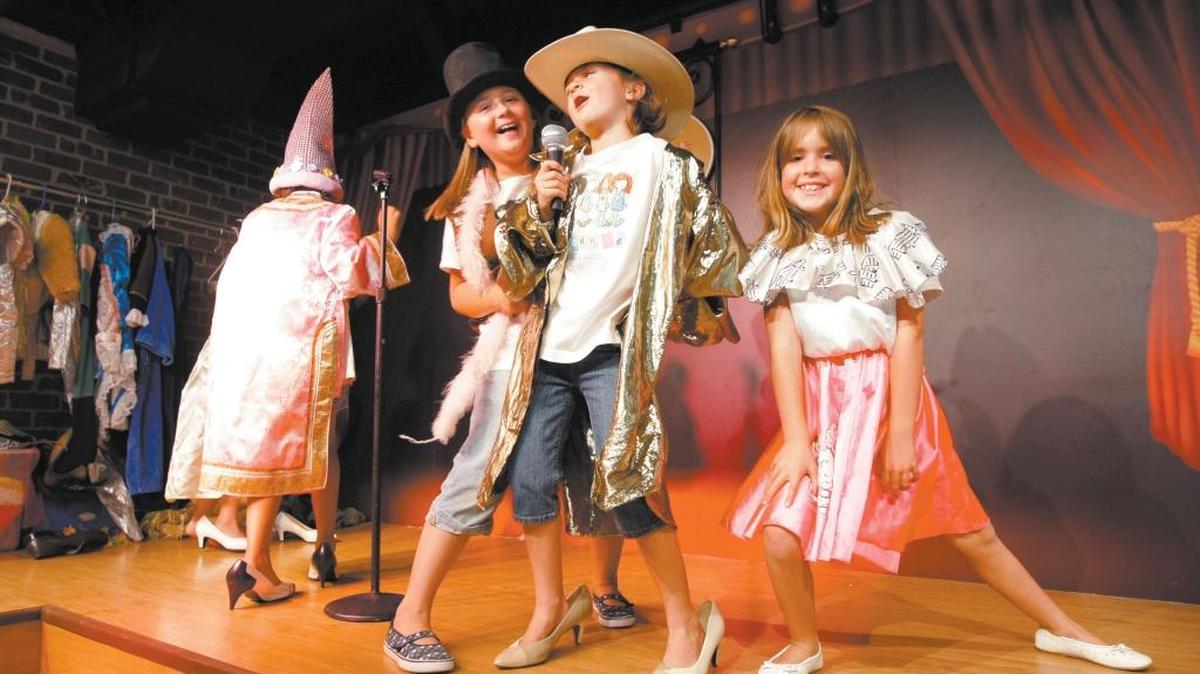 Mariah Byler, from right, Kyah Pomi and Lily Folkrod “perform” on the Phyllis Madonna Performance Stage at the San Luis Obispo Children’s Museum in 2008.