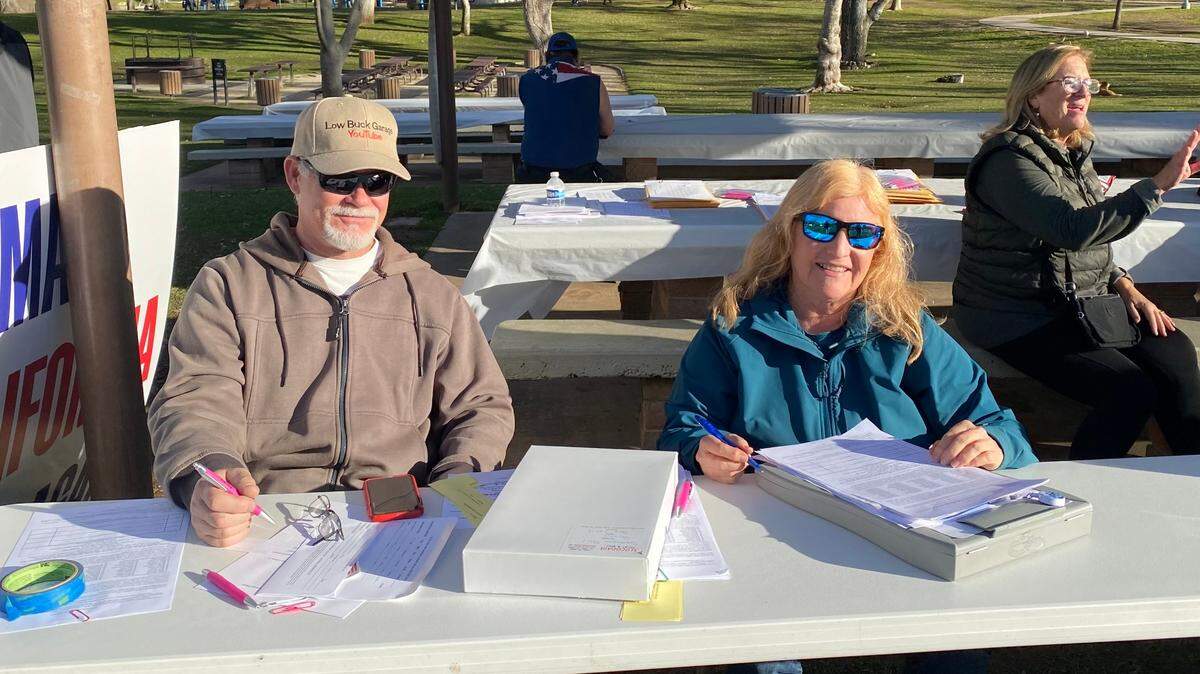 San Luis Obispo County residents Tom Bolton and Nancy Shaw collect signatures on the petition to recall county Supervisor Bruce Gibson at Atascadero Lake Park on Sunday, Jan. 14, 2024.
