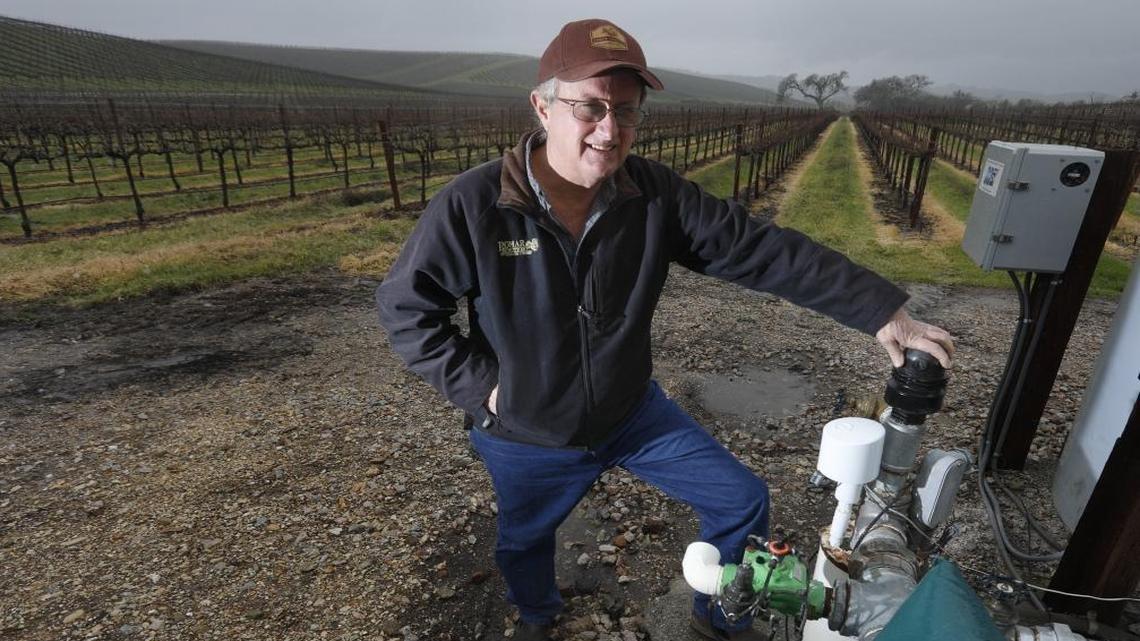 Dana Merrill, standing next to one of the wells that irrigates his property, owns Pomar Junction Vineyard & Winery and is helping to form the Estrella-El Pomar-Creston water district in the North County. Landowners in the area can decide if they want to “opt in” and become part of the district, in order to comply with the Sustainable Groundwater Management Act.