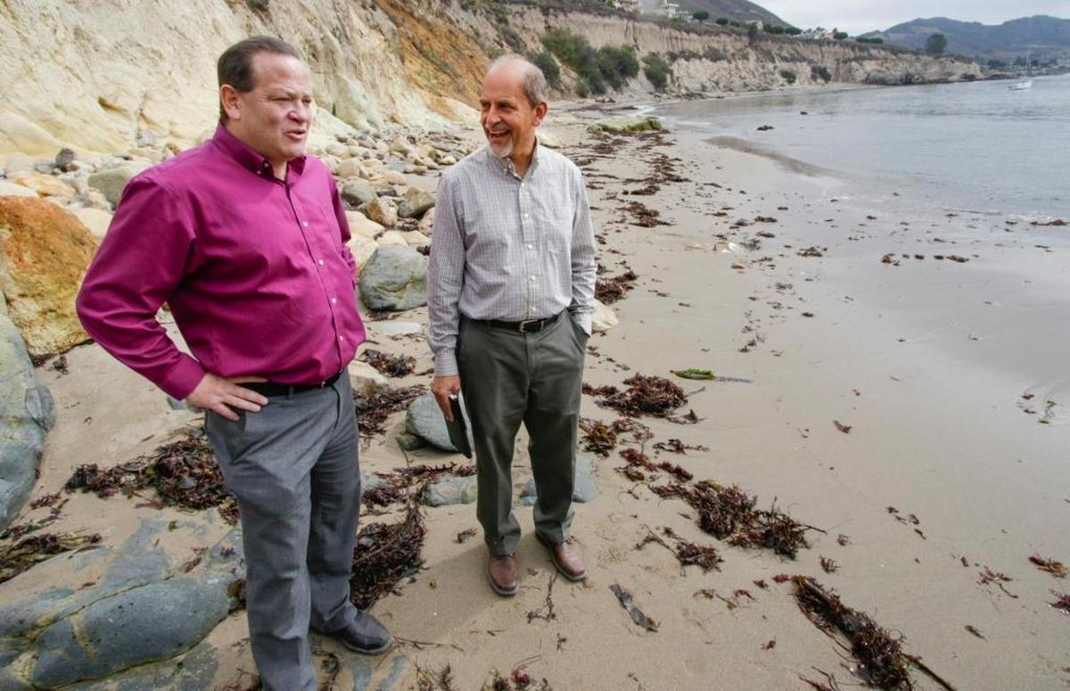 County Supervisor Adam Hill, left, and county Parks Director Nick Franco talk about the future of Pirate’s Cove during a visit in September 2016.